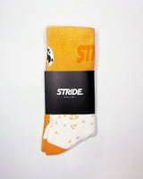 Stride Tropic Tempo running sock folded in its black STRIDE card sleeve