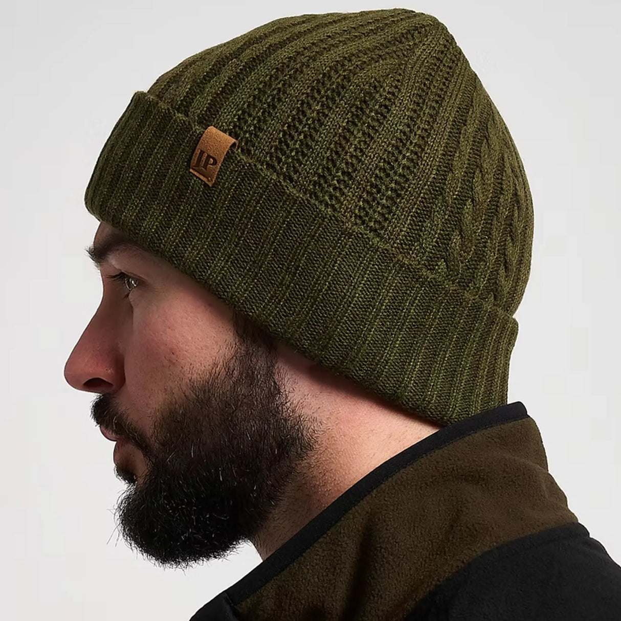 Jack Pyke Merino Wool Beanie Hat in olive green from the side on white background
