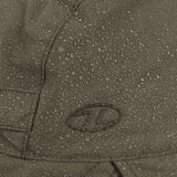 Highlander Waterproof Mountain Hat - close-up of water beading on the Ranger Green waterproof fabric beside the embroidered logo