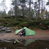 Vango Nevis 200 Tent in green for camping from side with person