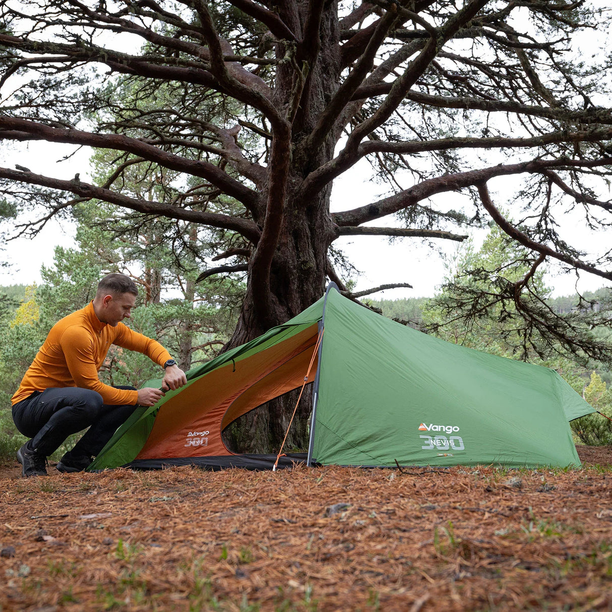 Vango Nevis 300 Tent in green for camping from side with person