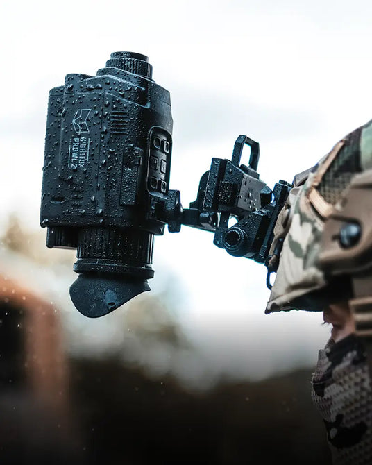 Nightfox Prowl 2 Monocular on tactical helmet in a military setting