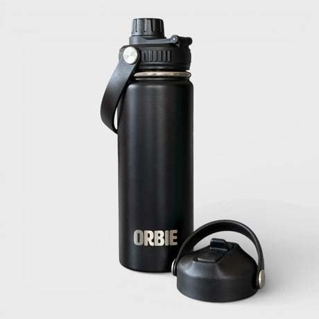 Orbie 18oz insulated water bottle in black with the chug lid fitted and the sip lid standing alongside