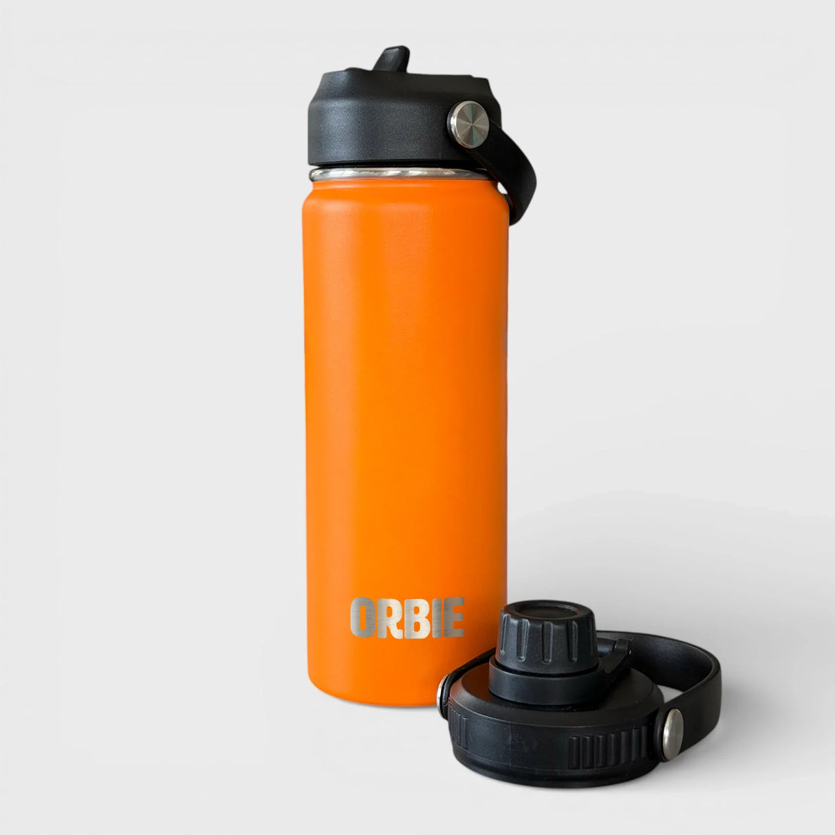Orbie 18oz insulated water bottle in orange with the sip lid fitted and the chug lid standing alongside