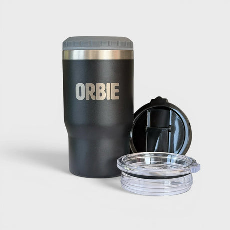 Orbie 12oz insulated cup in black with the grey can cooler collar fitted, beside the flip-top and sliding sip lids