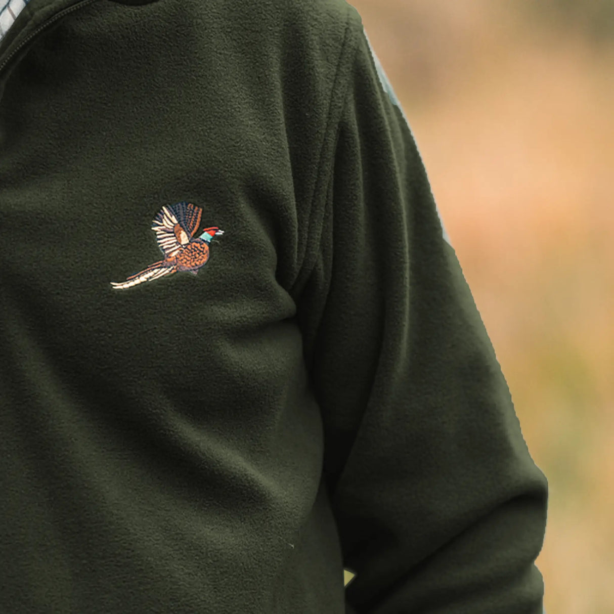 Jack Pyke Pheasant Fleece Pullover in Dark Olive from the front outdoors