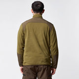 Jack Pyke Rannock Fleece Pullover in dark mustard worn by a model, back view showing the smooth contrast panels across the shoulders and forearms