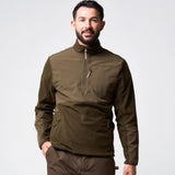 Jack Pyke Rannock Fleece Pullover in dark olive worn by a model, smiling front view with the fleece-lined collar zipped up