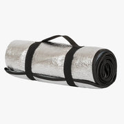 Highlander Reflective Camping Mat - rolled mat showing silver reflective foil outer surface with black elastic carry strap on white background