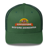 Adventure Before Dementia Trucker Cap in Evergreen, front view of the embroidered badge