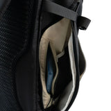 Highlander Roam Backpack 28L in black close up of the zip side pocket on white background
