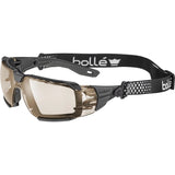 Bolle Rush+ 2.0 XP Safety Glasses - copper lens with foam gasket and adjustable Bolle strap, angled view showing the temple hinge and strap connector