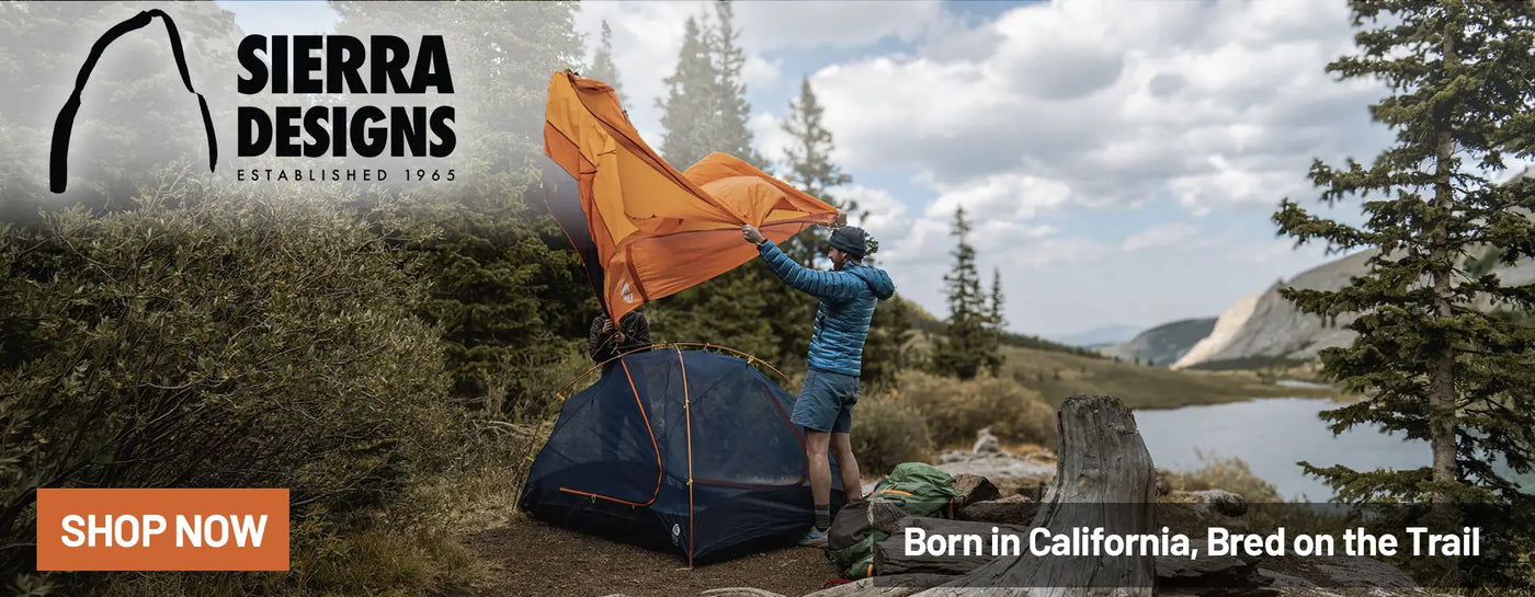 Sierra Designs Camping Gear: Man Outdoors Pitching Tent