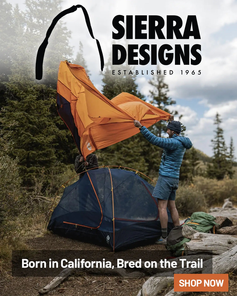 Sierra Designs Camping Gear: Man Outdoors Pitching Tent