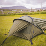 Snugpak Stratosphere WGTE Bivvi Shelter in Olive Green - angled view showing the single pole hoop and low tapered profile