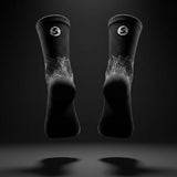 Stride North East Trail Running Socks in Black pair from the back on black background