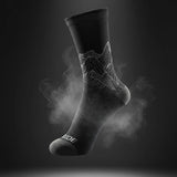 Stride North East Trail Running Socks in Black from the side  on black background
