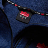 Sugar Loaf Fell Half Zip Fleece Top in Navy Blue close up of branding on collar