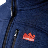 Sugar Loaf Fell Half Zip Fleece Top in Navy Blue close up of branding on chest