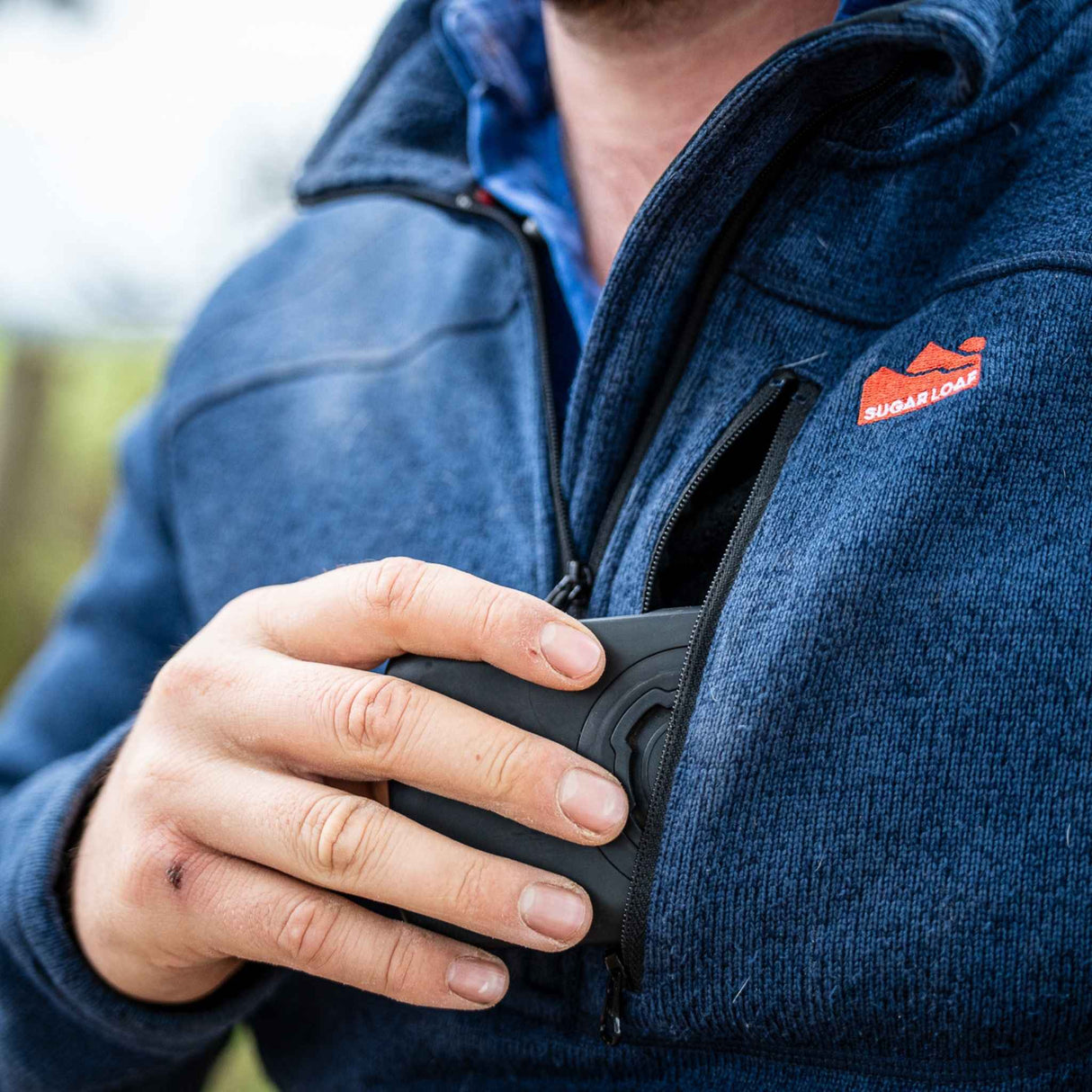 Sugar Loaf Fell Half Zip Fleece Top in Navy Blue close up of chest zip pocket