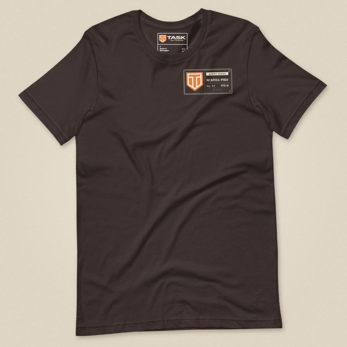Summit Series Scafell Pike T-Shirt in Brown, laid flat, front view with the left-chest badge