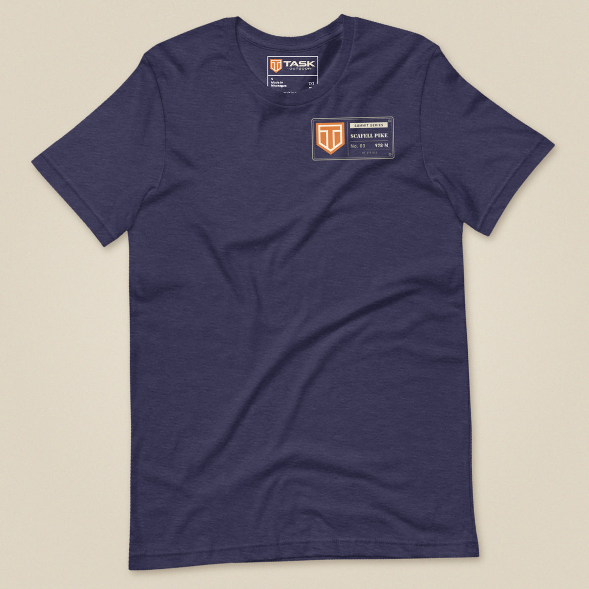 Summit Series Scafell Pike T-Shirt in Heather Midnight Navy, laid flat, front view with the left-chest badge