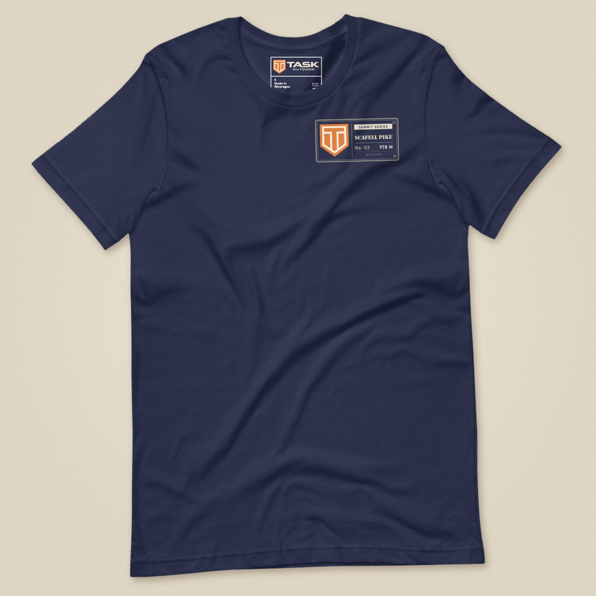 Summit Series Scafell Pike T-Shirt in Navy, laid flat, front view with the left-chest badge