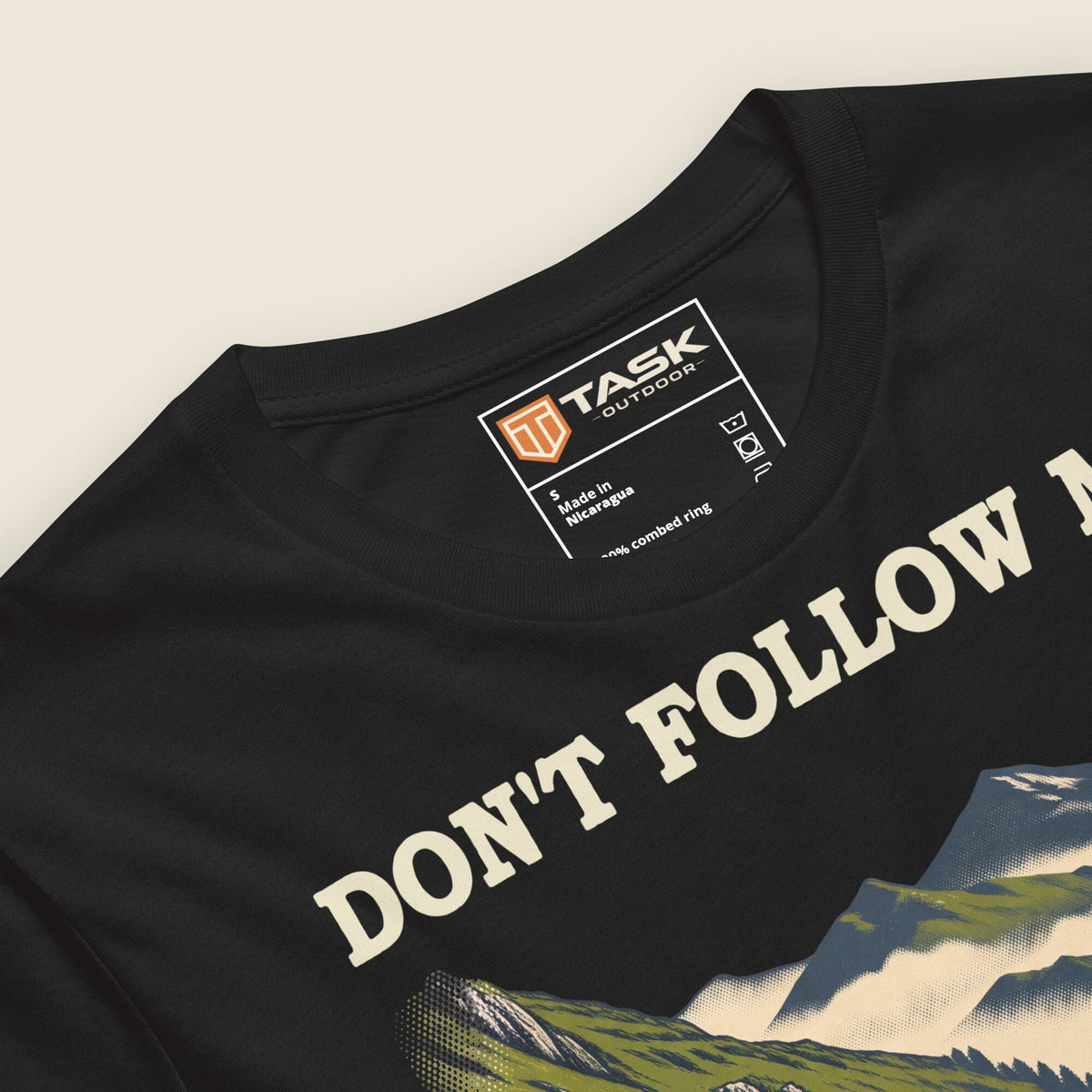 Don't Follow Me, I'm Lost Too Unisex T-Shirt in Vintage Black, angled close-up of the print and printed neck label