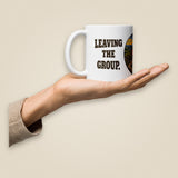 Leaving The Group White Glossy Ceramic Mug in 11 oz, held in hand, handle on left