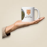 Leaving The Group White Glossy Ceramic Mug in 11 oz, held in hand, handle on right