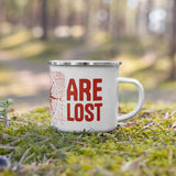 Not All Who Wander Are Lost Enamel Mug in White, on moss in a forest