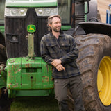 Jack Pyke Tundra Shirt in green on a man with a tracker, on a farm