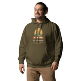Adventure Before Dementia Camping Hoodie in Military Green, worn by a model, angled front view