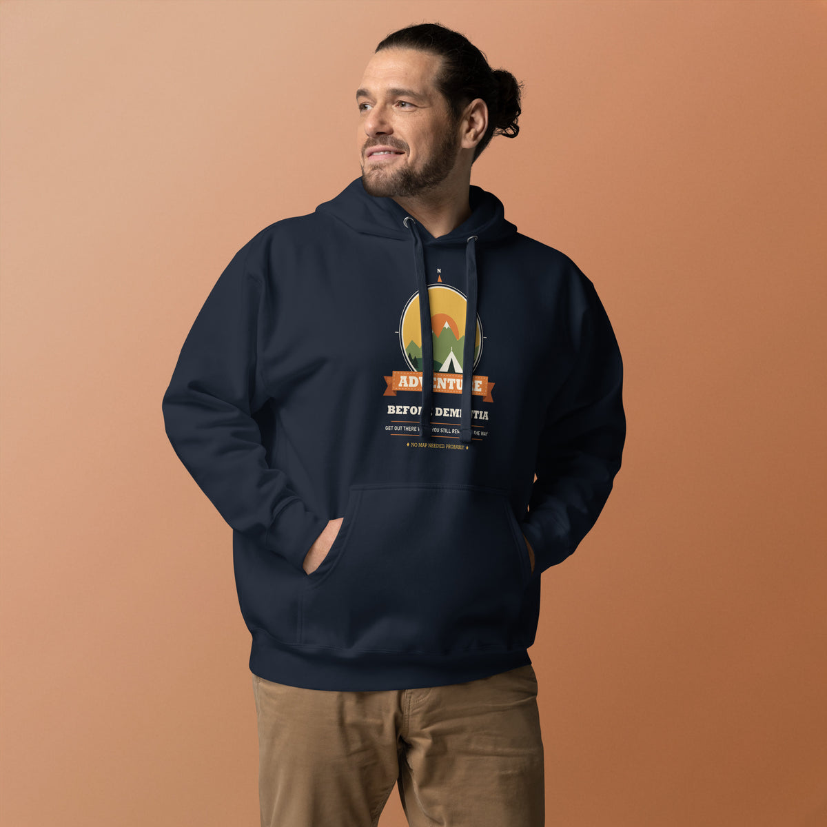 Adventure Before Dementia Camping Hoodie in Navy Blazer, worn by a model against an orange background